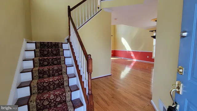 a view of entryway with wooden floor