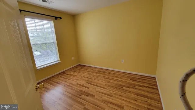 a bathroom with a shower and a door