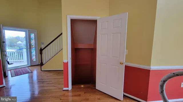 a view of kitchen and living room with a wooden floor