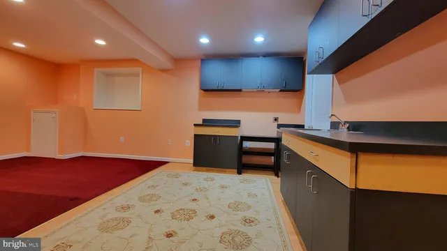 a kitchen with stainless steel appliances a refrigerator and a stove top oven