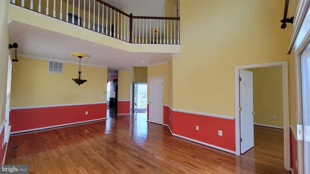 a view of a living room with wooden floor