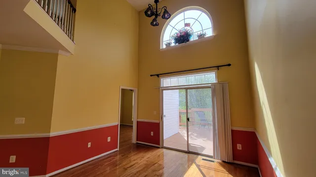 a view of room with wooden floor