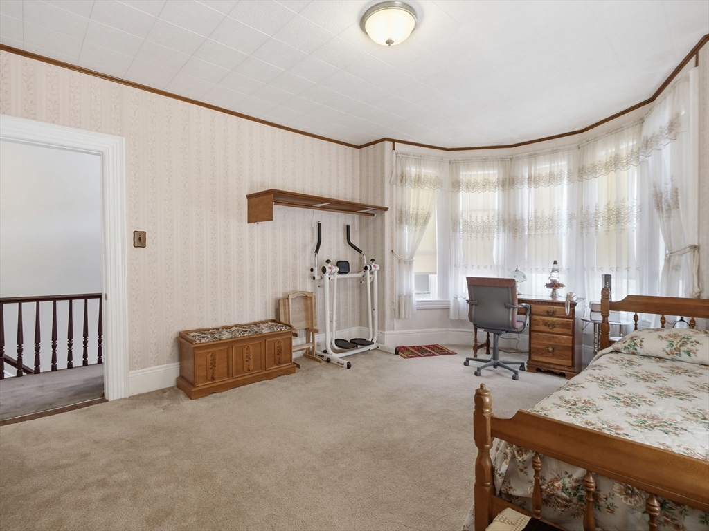 223 Stackpole Street Lowell, MA 01852 - Photo 15 of 42 a view of a livingroom with workspace and a window