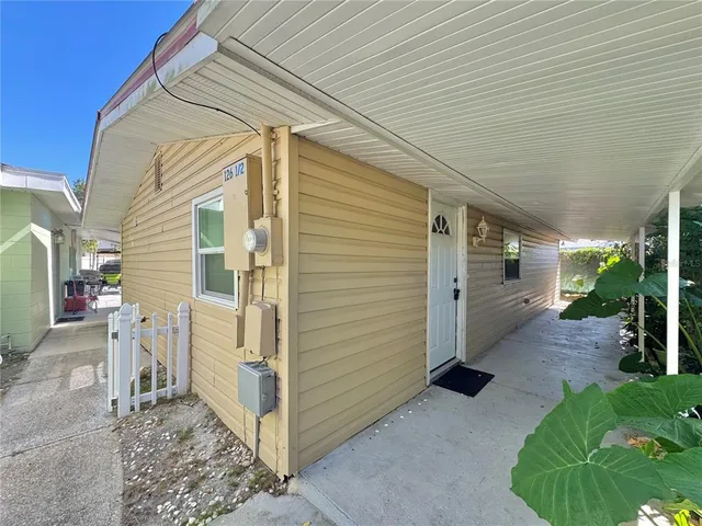 a view of a house with backyard