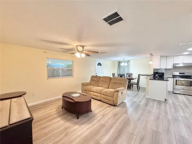 a kitchen with granite countertop a sink and cabinets