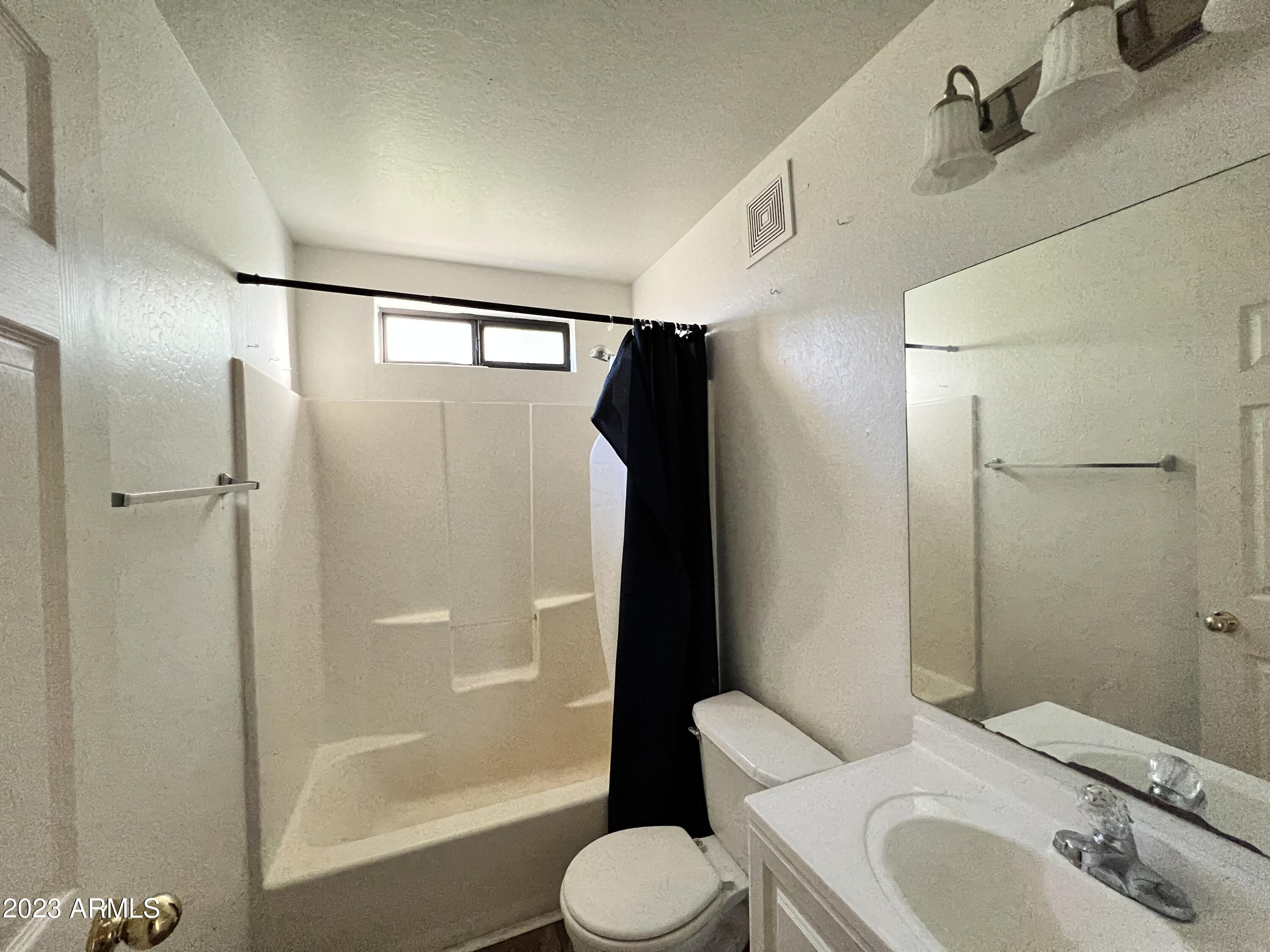 1287 North Alma School Road, Unit 224 Chandler, AZ 85224 - Photo 5 of 8 a bathroom with a sink toilet and shower