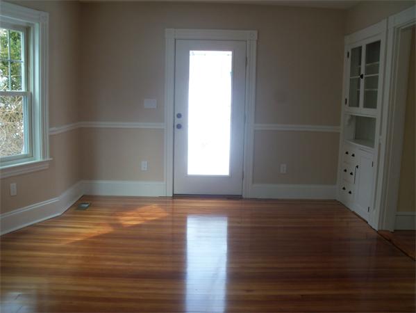 37 Cummings Road Newton, MA 02459 - Photo 6 of 26 a view of an empty room with wooden floor and a window