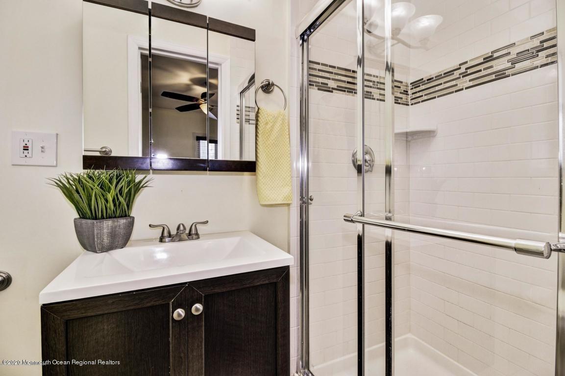 319 Arnold Avenue Point Pleasant Beach, NJ 08742 - Photo 13 of 34 a bathroom with a sink and a mirror