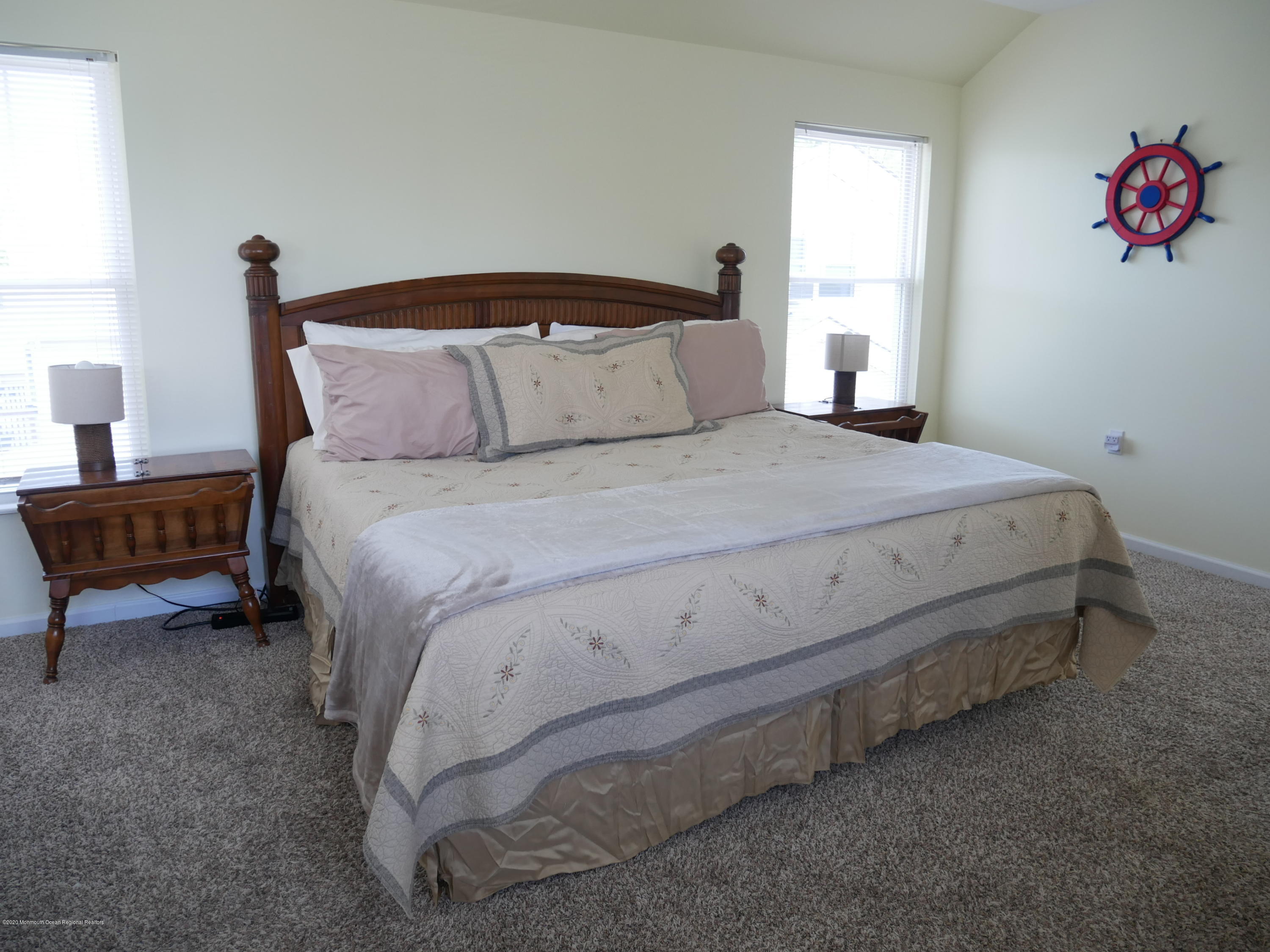 319 Arnold Avenue Point Pleasant Beach, NJ 08742 - Photo 22 of 34 a bedroom with a bed and a couch