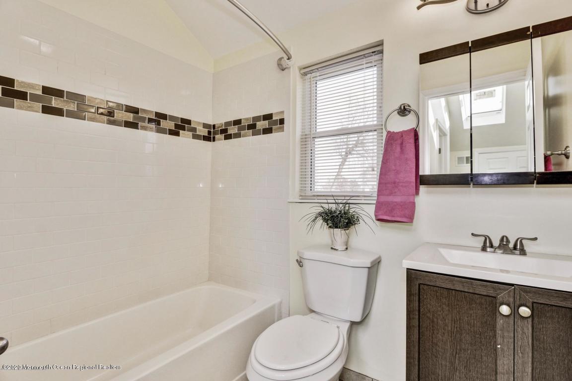 319 Arnold Avenue Point Pleasant Beach, NJ 08742 - Photo 24 of 34 a bathroom with a sink mirror toilet and bathtub