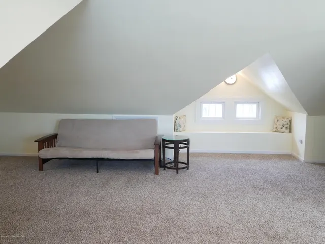 a view of livingroom with furniture and window