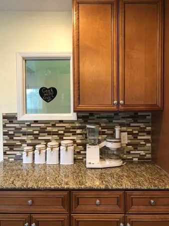 a bathroom with mirror sink and vanity