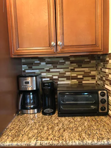 a stove top oven sitting inside of a kitchen