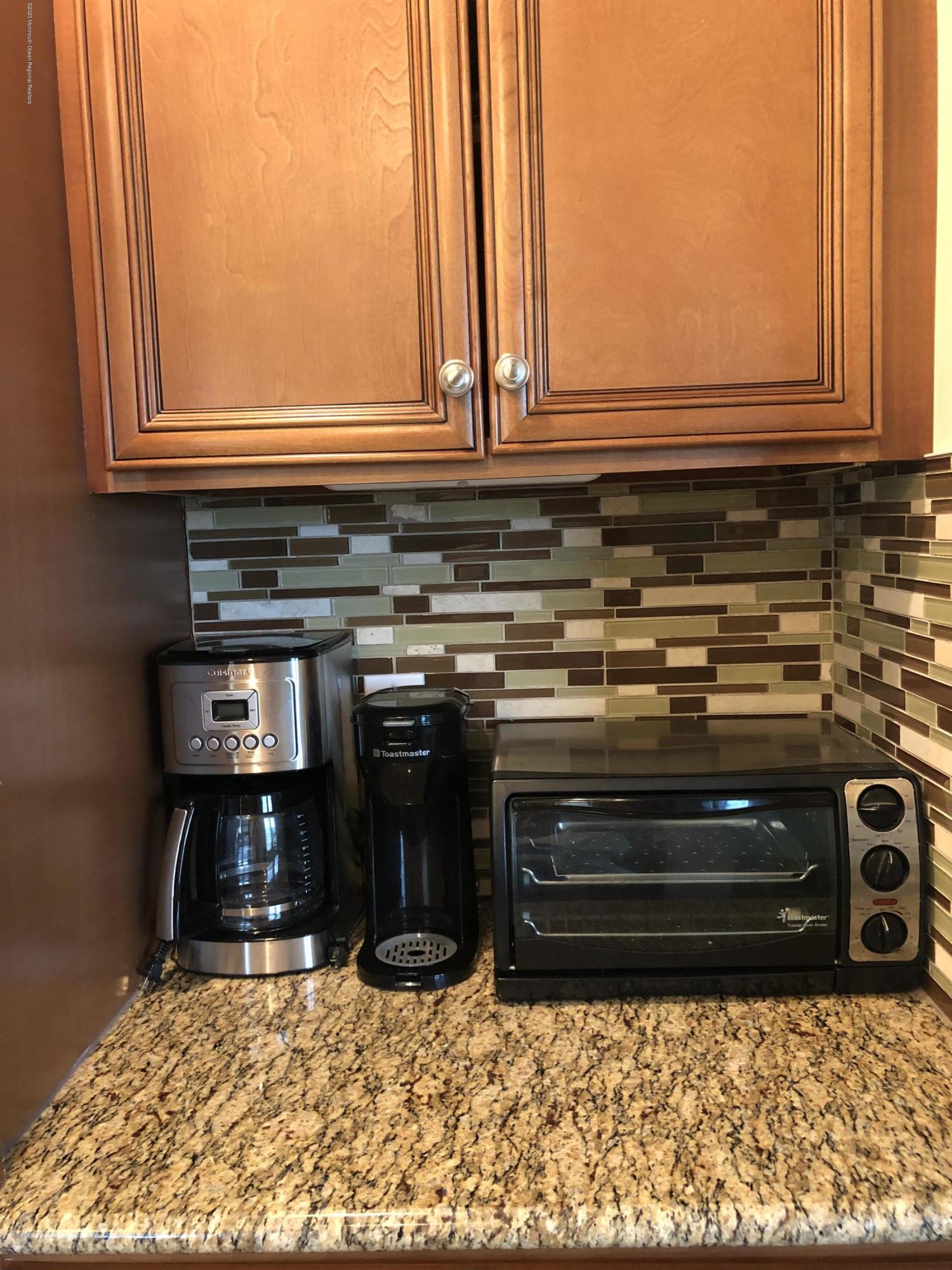 319 Arnold Avenue Point Pleasant Beach, NJ 08742 - Photo 10 of 34 a stove top oven sitting inside of a kitchen