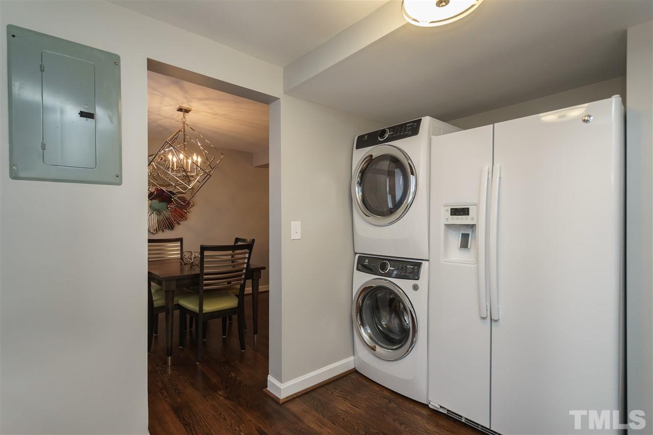 1641 Sutton Drive, Unit 3 Raleigh, NC 27605 - Photo 10 of 19 a view of a storage and utility room with washer and dryer