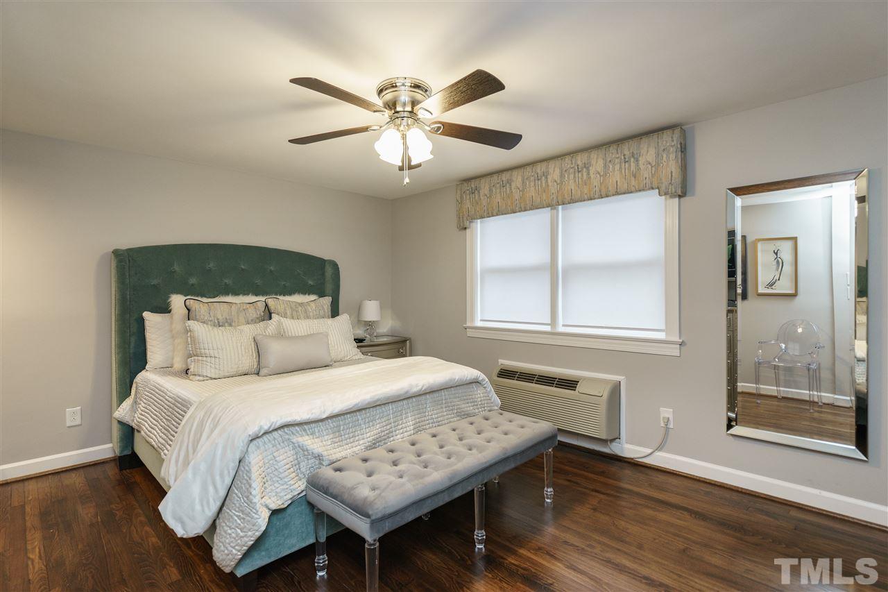 1641 Sutton Drive, Unit 3 Raleigh, NC 27605 - Photo 12 of 19 a bedroom with a bed and a window