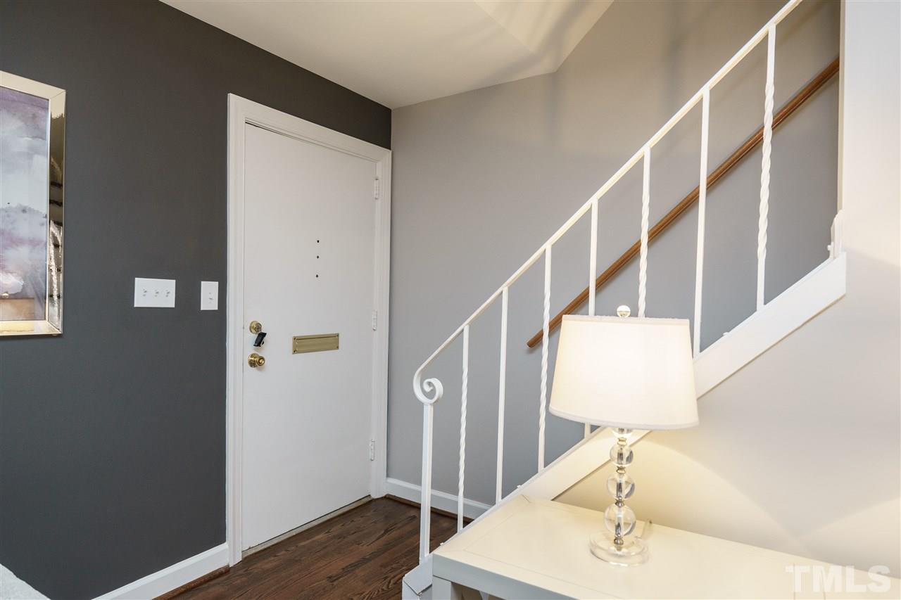 1641 Sutton Drive, Unit 3 Raleigh, NC 27605 - Photo 15 of 19 a view of entryway and hall with wooden floor