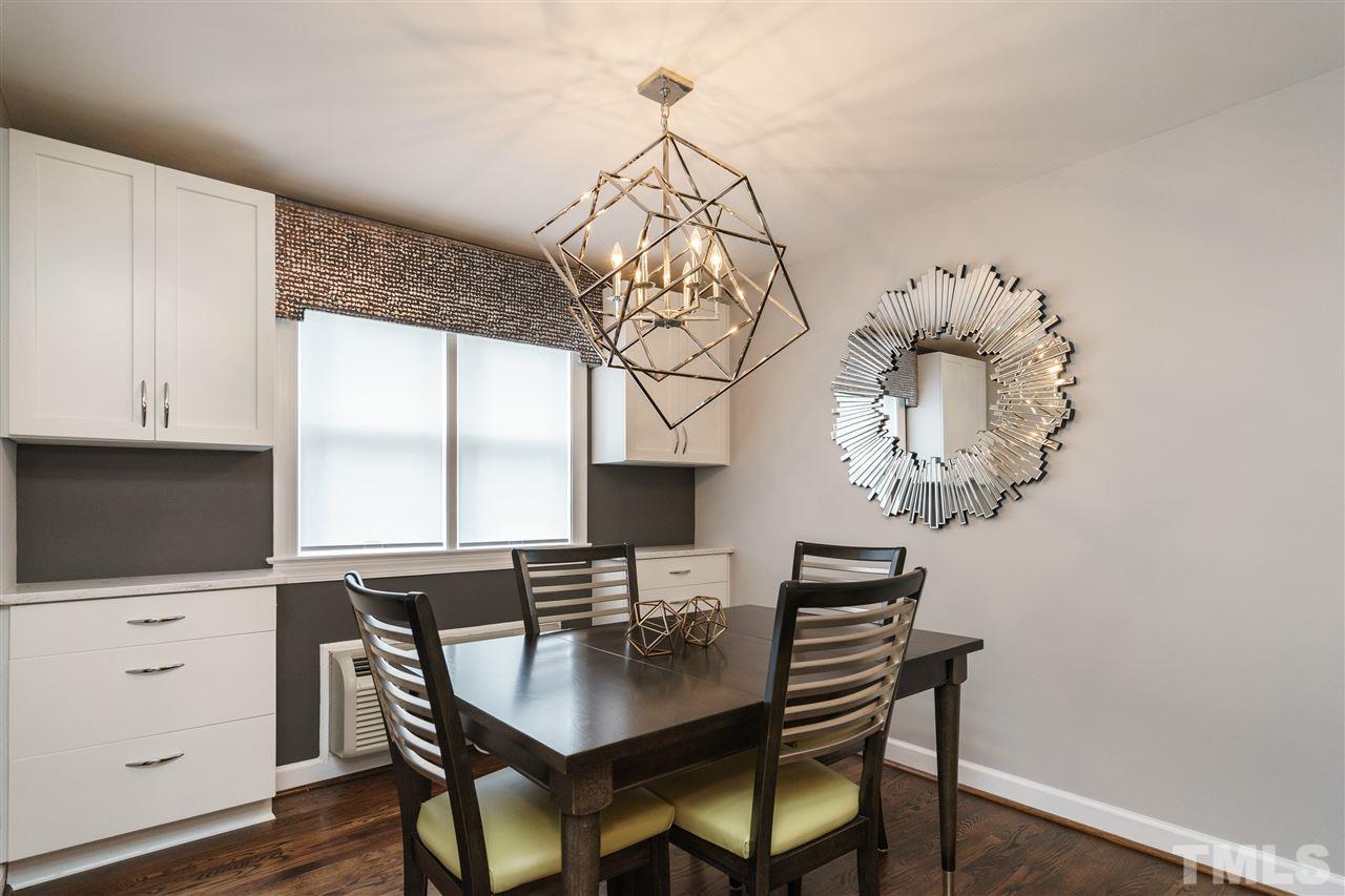 1641 Sutton Drive, Unit 3 Raleigh, NC 27605 - Photo 6 of 19 a view of a dining room with furniture and wooden floor