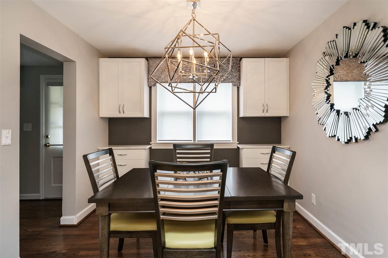 1641 Sutton Drive, Unit 3 Raleigh, NC 27605 - Photo 7 of 19 a view of a dining room with furniture and wooden floor