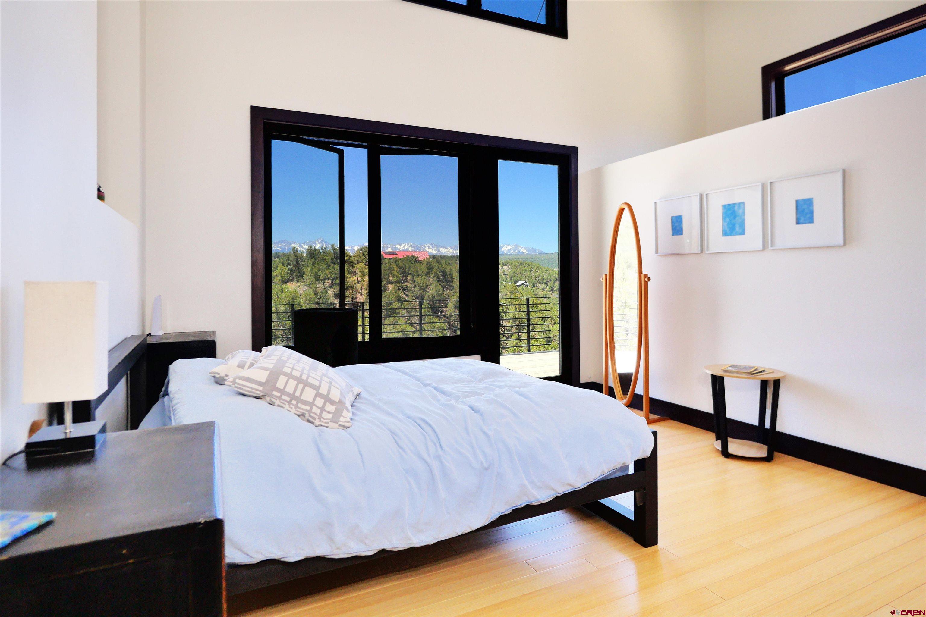 456 Ridge Road Montrose, CO 81403 - Photo 10 of 24 a bedroom with a bed and a window