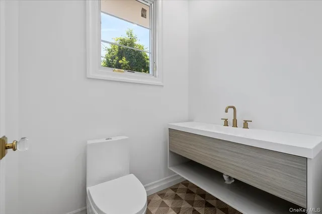 a bathroom with a toilet and a sink