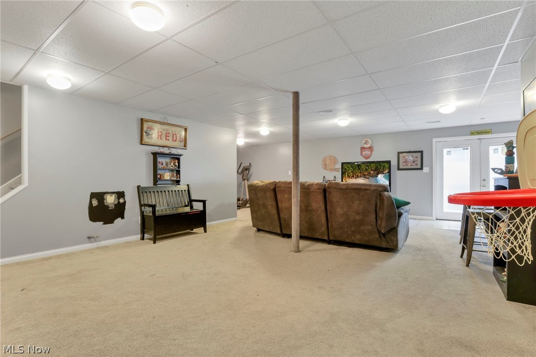 3483 Cooper Road Cumberland, OH 43732 - Photo 32 of 50 Carpeted living room featuring french doors and a paneled ceiling