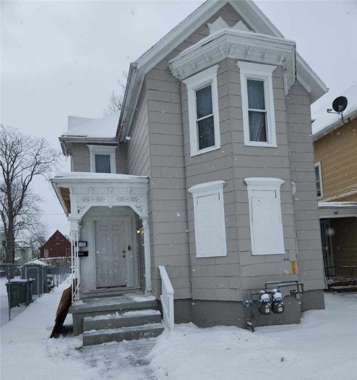 Recently painted exterior. Windows have been board