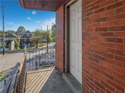 a view of a balcony with an outdoor space