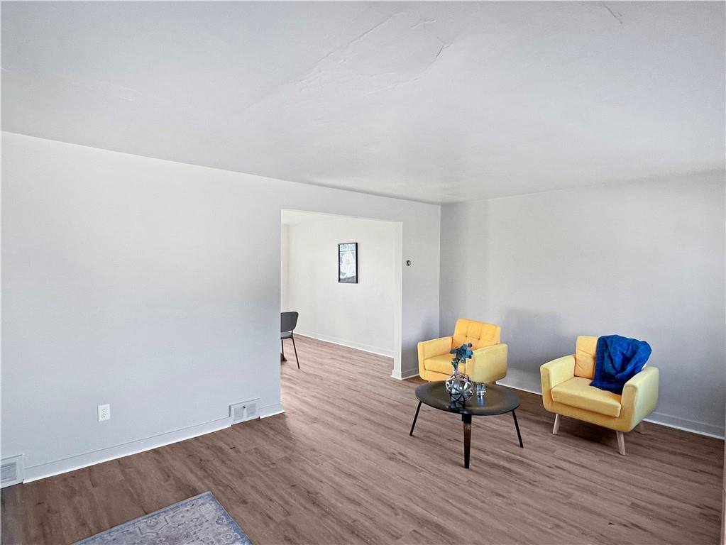 6444 Apple Street Pittsburgh, PA 15206 - Photo 2 of 28 a living room with furniture and wooden floor