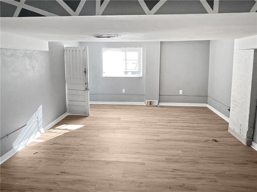 6444 Apple Street Pittsburgh, PA 15206 - Photo 23 of 28 a view of empty room with window and wooden floor