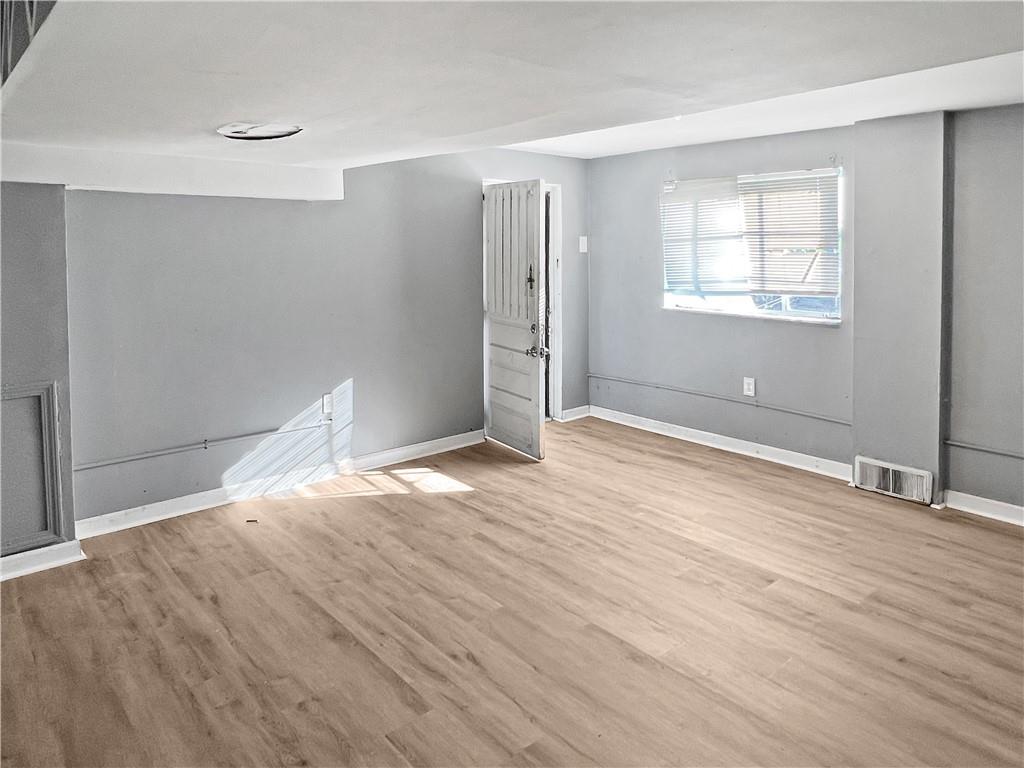 6444 Apple Street Pittsburgh, PA 15206 - Photo 24 of 28 a view of empty room with wooden floor and fan
