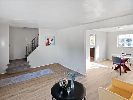 a view of a livingroom with furniture and wooden floor
