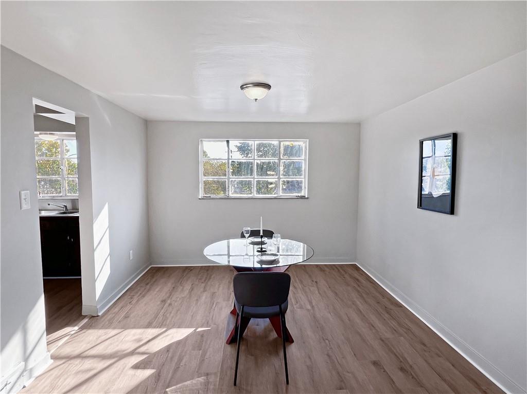 6444 Apple Street Pittsburgh, PA 15206 - Photo 4 of 28 a view of a workspace with furniture and a window