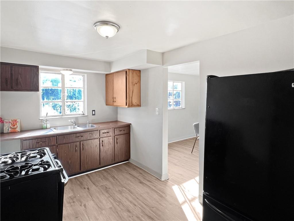 6444 Apple Street Pittsburgh, PA 15206 - Photo 9 of 28 a kitchen with a refrigerator and a sink