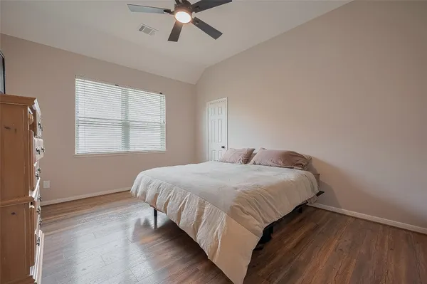 a bedroom with a bed and window