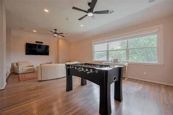 a view of a dining room with furniture window and wooden floor