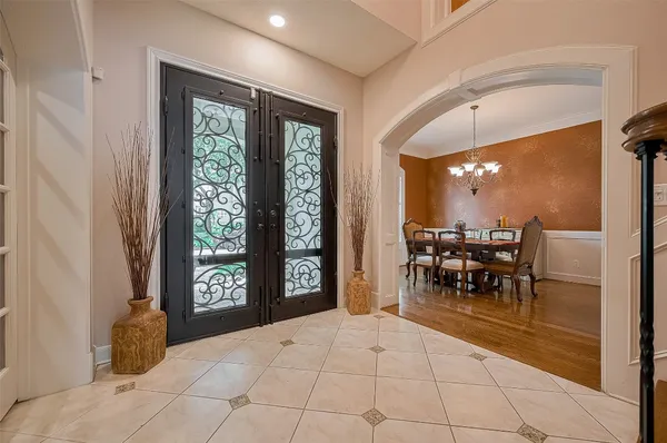 a view of a dining room with furniture and a window