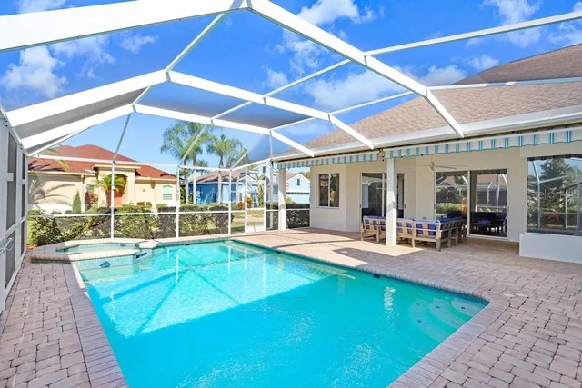 a view of a swimming pool with a patio