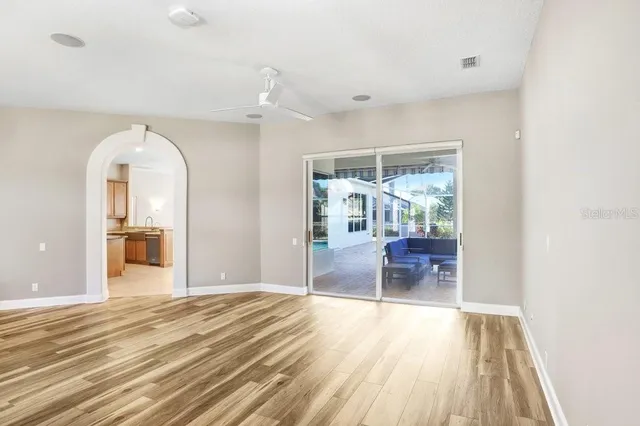 a view of a room with wooden floor