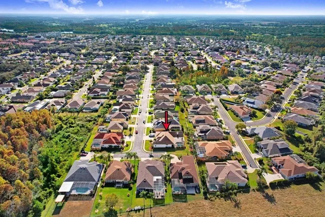 an aerial view of a house with a garden