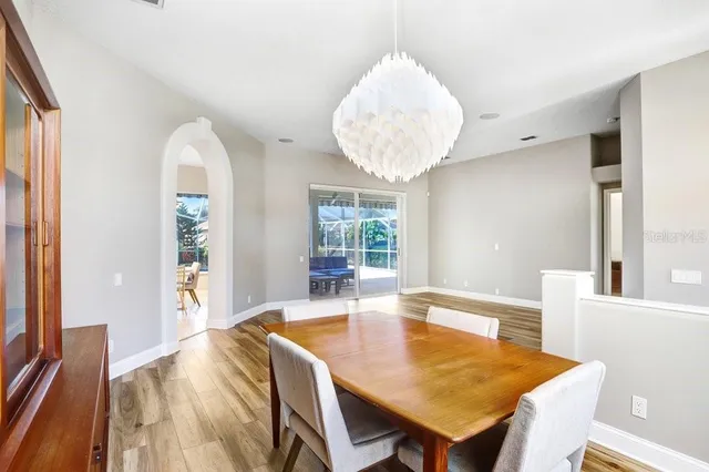 a view of a dining room with furniture and wooden floor