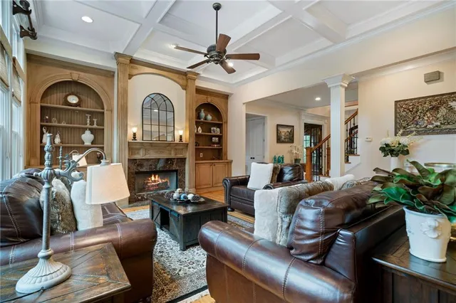 a kitchen with stainless steel appliances granite countertop a refrigerator stove and sink