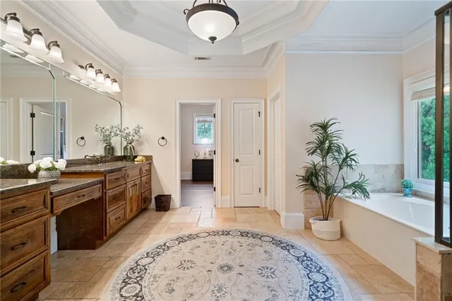 an aerial view of a house with a yard and fountain