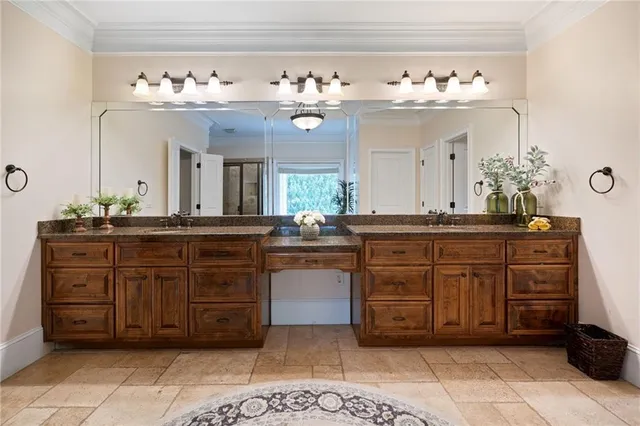 an aerial view of residential house with outdoor space and trees all around