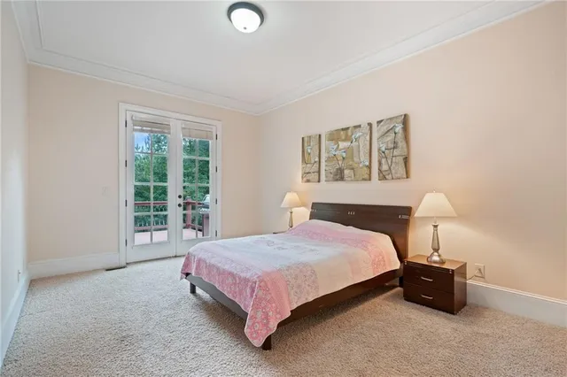 a living room with fireplace furniture and a large window
