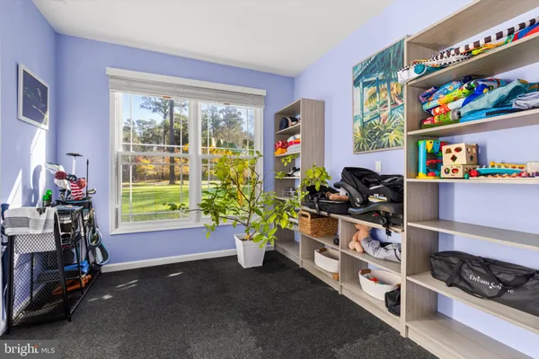 a view of living room with furniture and floor to ceiling window