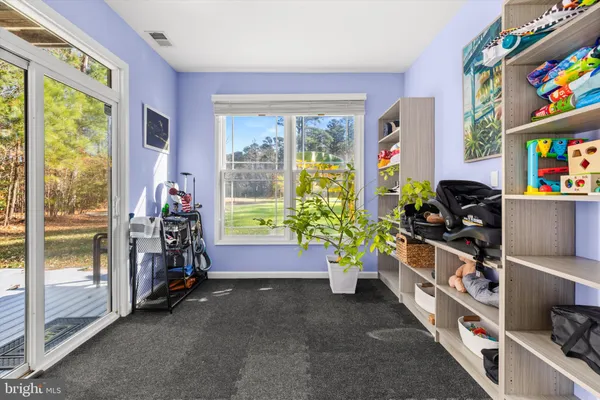 a living room with furniture and windows