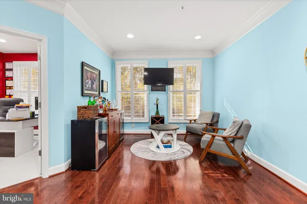 a kitchen with stainless steel appliances kitchen island granite countertop a stove a sink a dining table and chairs