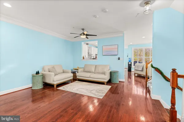 a view of a balcony with wooden floor and outdoor seating