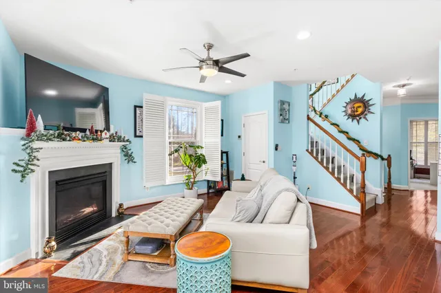 a living room with a couch and a chandelier